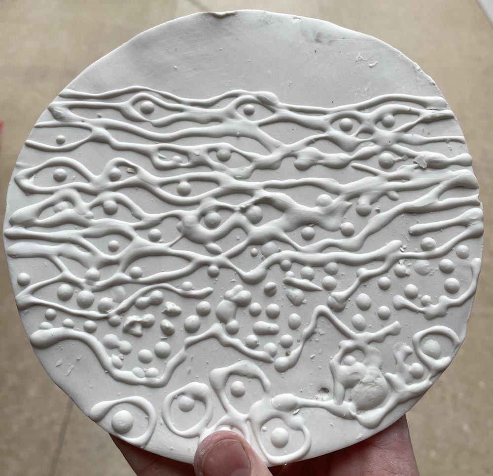 Slip trailed porcelain in the pattern of epithelial cells.